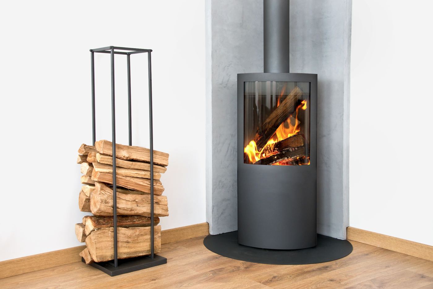 Modern corner woodburner with a log store