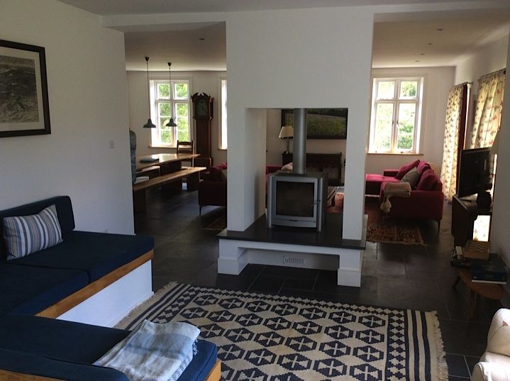 Woodburner in a through-room fireplace